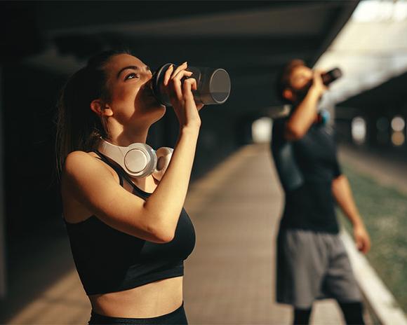 couple drinking whey supplement drink 